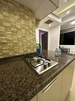 Apartment, 1 Bedroom, Accessible, Smoking | Private kitchen - Charming Amman Apartment With Electric Heating & Pool Access (Amman)