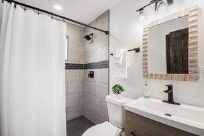 Shower, hair dryer, towels, soap