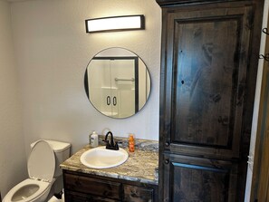 Shower, towels, soap, toilet paper