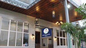 The Boutique Hotel JooPur with a wooden facade, large windows, and a signboard. - The Byke Boutique - Amra Oasis Osian (Osian)