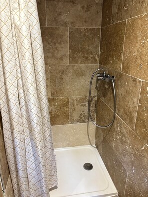 Shower, hair dryer, towels, toilet paper