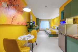Deluxe Studio, City View | In-room safe, desk, laptop workspace, blackout drapes