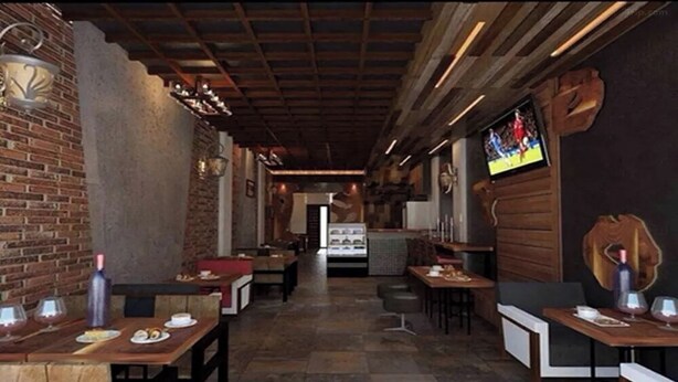 Un restaurante con paredes de ladrillo, mesas de madera y piso de baldosas.