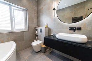 Shower, hair dryer, towels, soap - Tŷ Haul (Sun House) is not your typical holiday let. (Cefn-mawr)