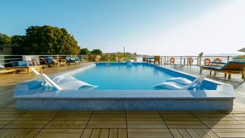 Outdoor pool, pool umbrellas, sun loungers