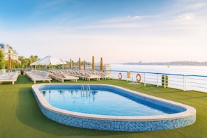Outdoor pool, pool umbrellas, pool loungers