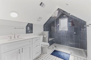 Shower, hair dryer, towels, soap