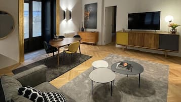 Standard Apartment | Living area | 55-inch Smart TV with digital channels, Netflix, streaming services