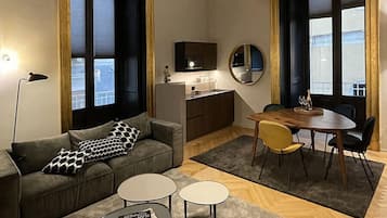 Standard Apartment | Living area | 55-inch Smart TV with digital channels, Netflix, streaming services