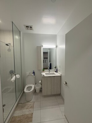 Shower, towels, soap, toilet paper