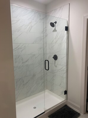 Shower, towels, soap, toilet paper