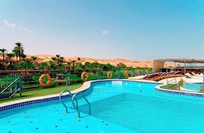 Outdoor pool, pool umbrellas, sun loungers
