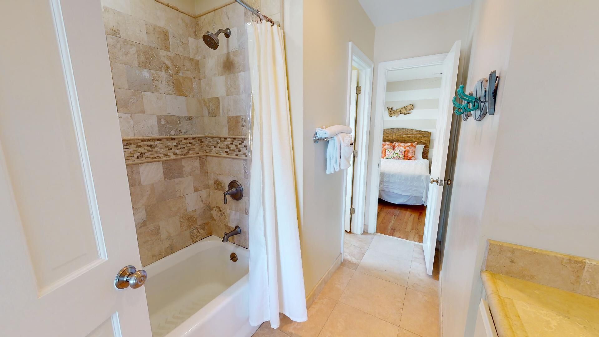 A bathroom with a shower, a bathtub, and a toilet.
