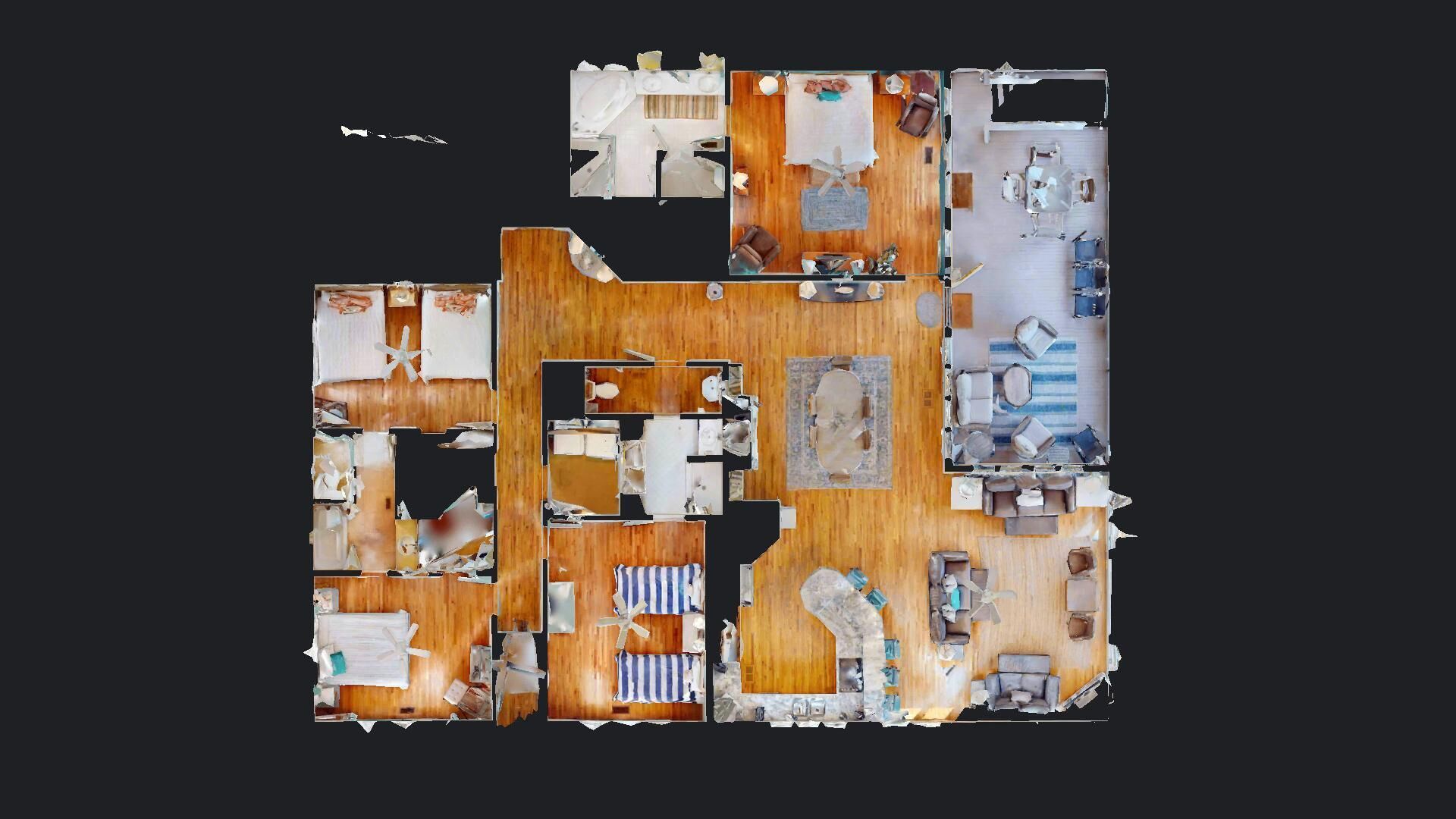A floor plan of a hotel with multiple rooms, a dining area, and a kitchen.