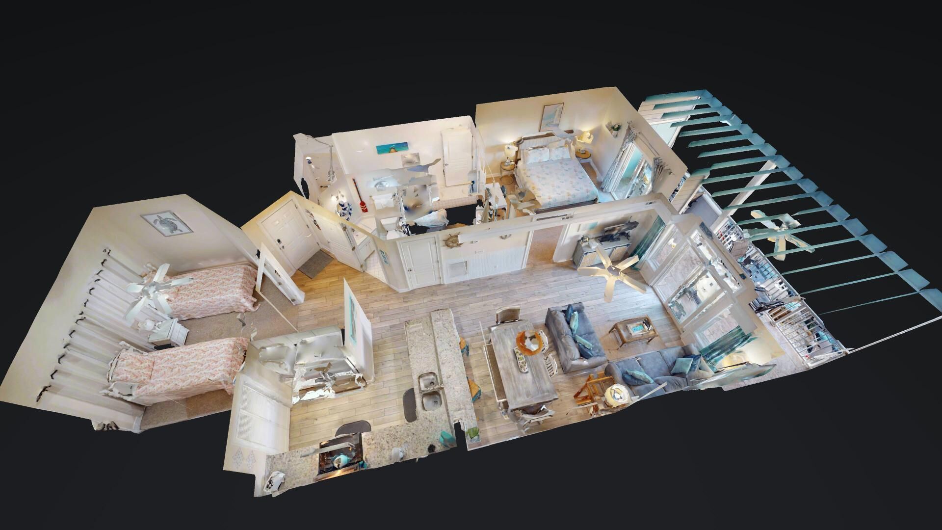 A 3D model of a hotel room with a balcony, a sitting area, a bed, a bathroom, and a kitchen area.