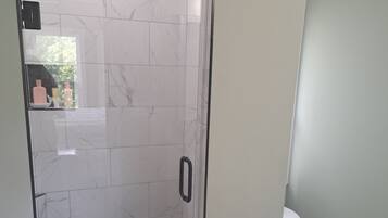 Shower, towels, soap, toilet paper