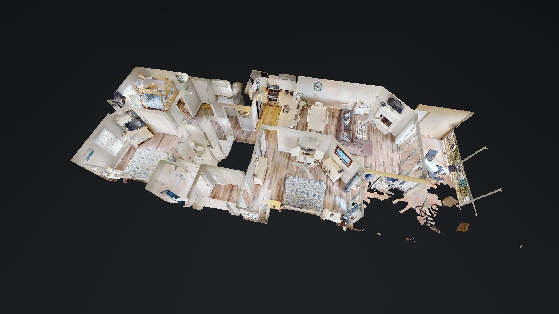 Un modèle 3D d’un hôtel comprenant plusieurs chambres, une cuisine et un espace repas.