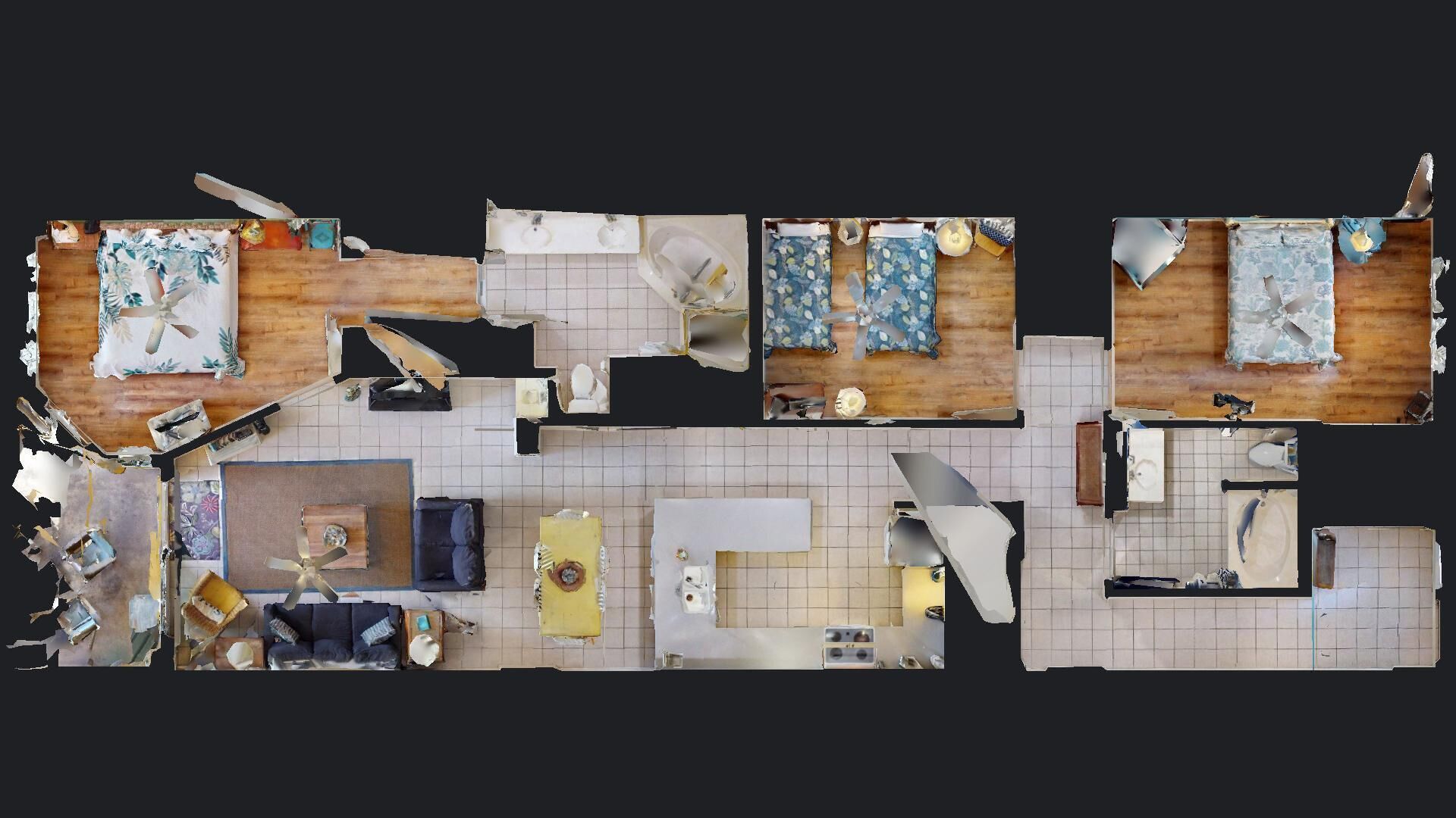 A floor plan of a hotel room with a bed, a desk, a chair, a small table, a sofa, and a bathroom with a bathtub and toilet.