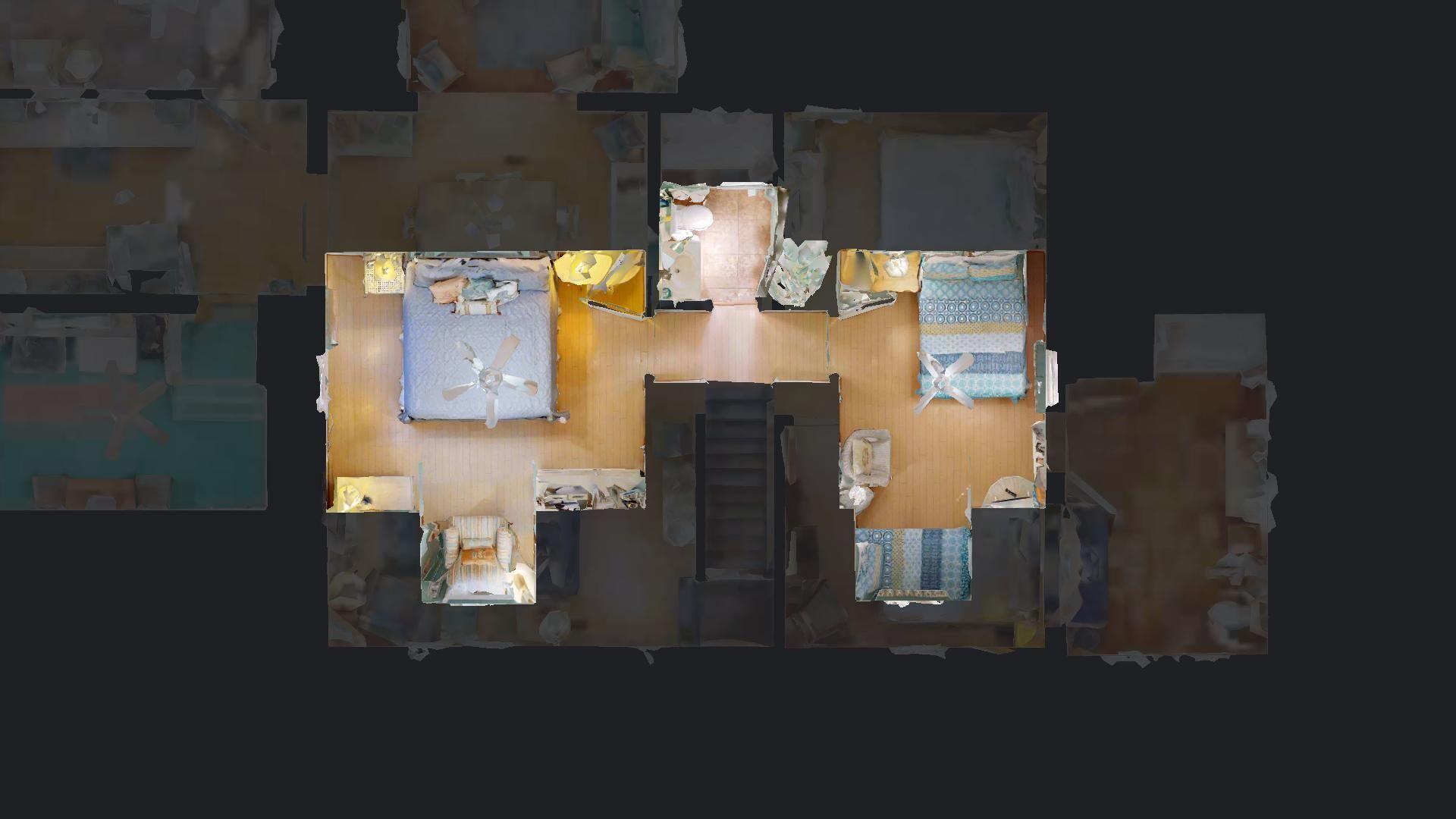A hotel room layout with a bed, a desk, a chair, a small table, and a window.