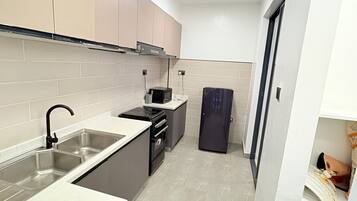 Fridge, microwave, electric kettle, cookware/dishes/utensils