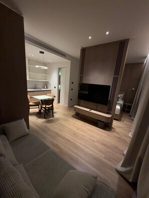 Deluxe Apartment, Kitchen, River View | Living area | 123-cm Smart TV with digital channels