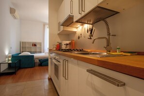 Fridge, microwave, stovetop, coffee/tea maker