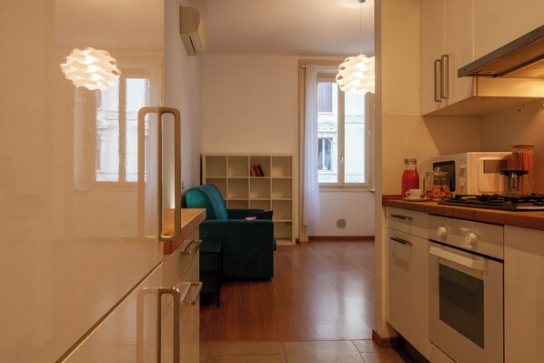 Fridge, microwave, stovetop, coffee/tea maker