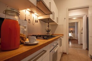 Fridge, microwave, stovetop, coffee/tea maker