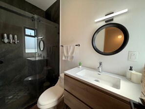 Shower, hair dryer, towels, soap