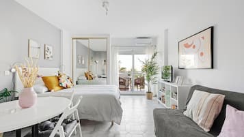 Studio, Balcony | Living area | Flat-screen TV