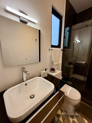 Shower, hair dryer, towels, soap