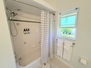 Shower, hair dryer, towels, soap