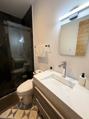 Shower, hair dryer, towels, soap