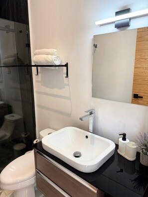 Shower, hair dryer, towels, soap