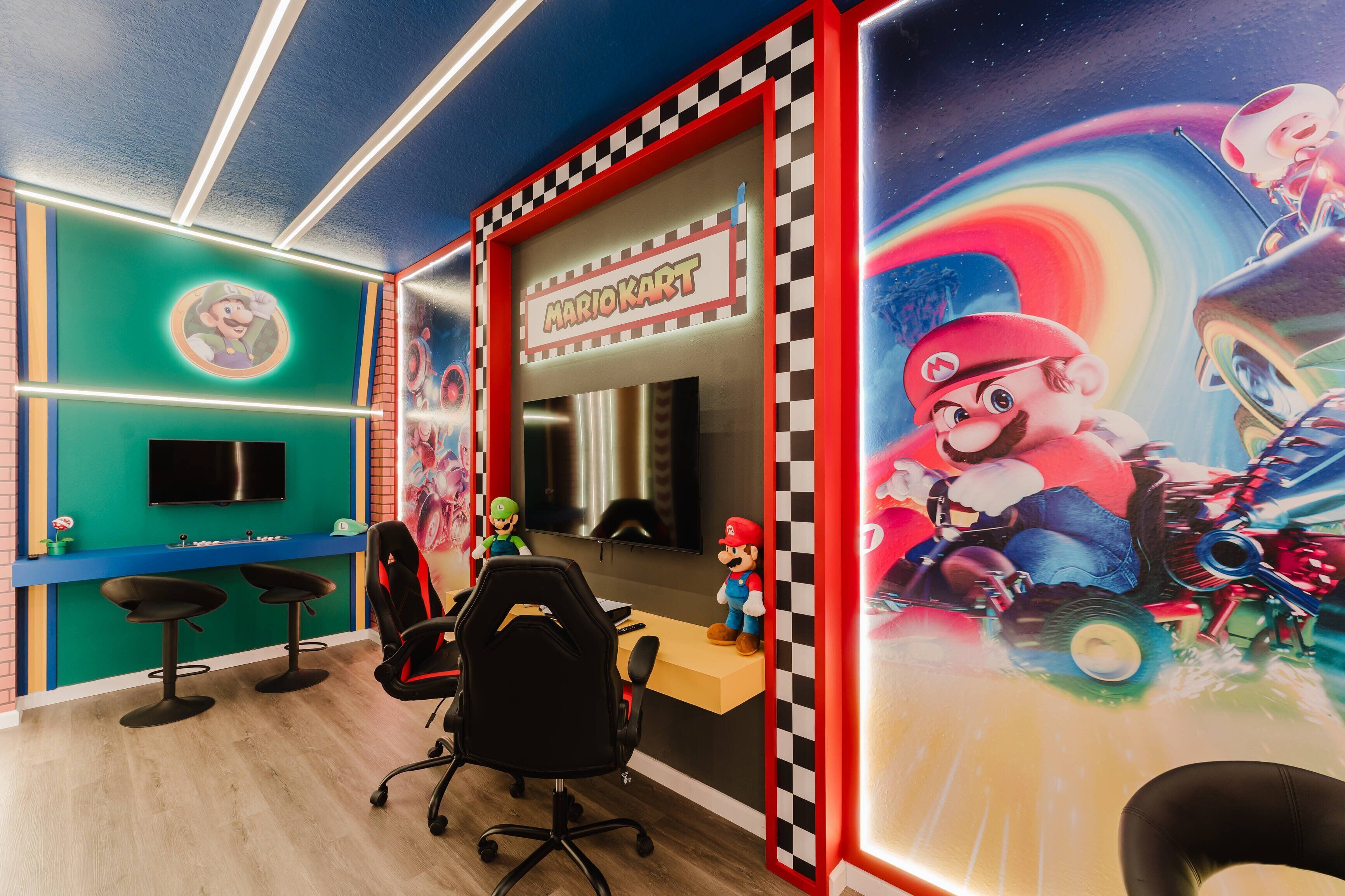 A Mario Kart-themed room with a gaming chair, a TV, and a Mario figurine.
