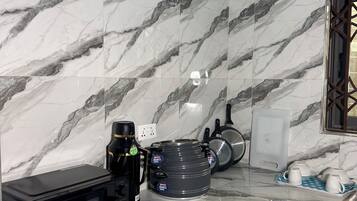 Mini-fridge, microwave, stovetop, cookware/dishes/utensils