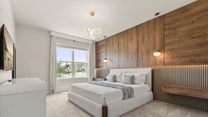 A modern bedroom with a large bed, a wooden accent wall, and a view of the outdoors.