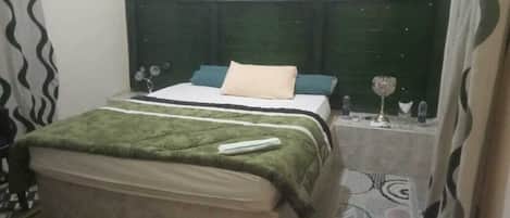 Premium bedding, memory-foam beds, desk, laptop workspace