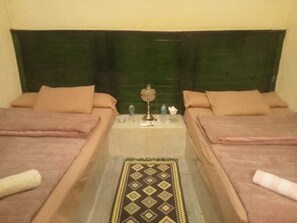 Premium bedding, memory-foam beds, desk, laptop workspace