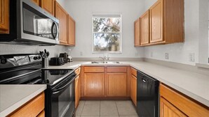 Coffee/tea maker, fridge, microwave, oven