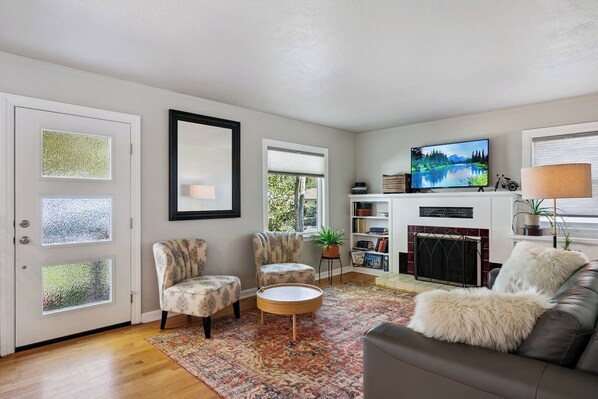 TV, fireplace, books