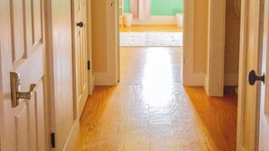 A hallway with wooden floors and white doors. - Minutes from SLU, Clarkson, & SUNY schools.  4-bd Family Friendly Farmhouse (Canton)