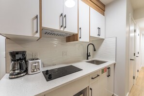 Microwave, stovetop - Bright Auburn Bay Suite – Private, Furnished, Walk to South Health Campus (Calgary)