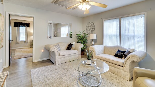 A living room with two sofas, a coffee table, a ceiling fan, and a potted plant. - Home < 3 Mi to Rte 66 & Lake Lou Yaeger! (Litchfield)