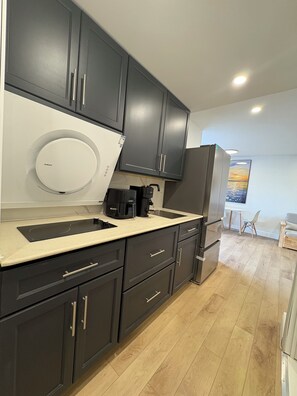 Microwave, stovetop, coffee/tea maker, paper towels