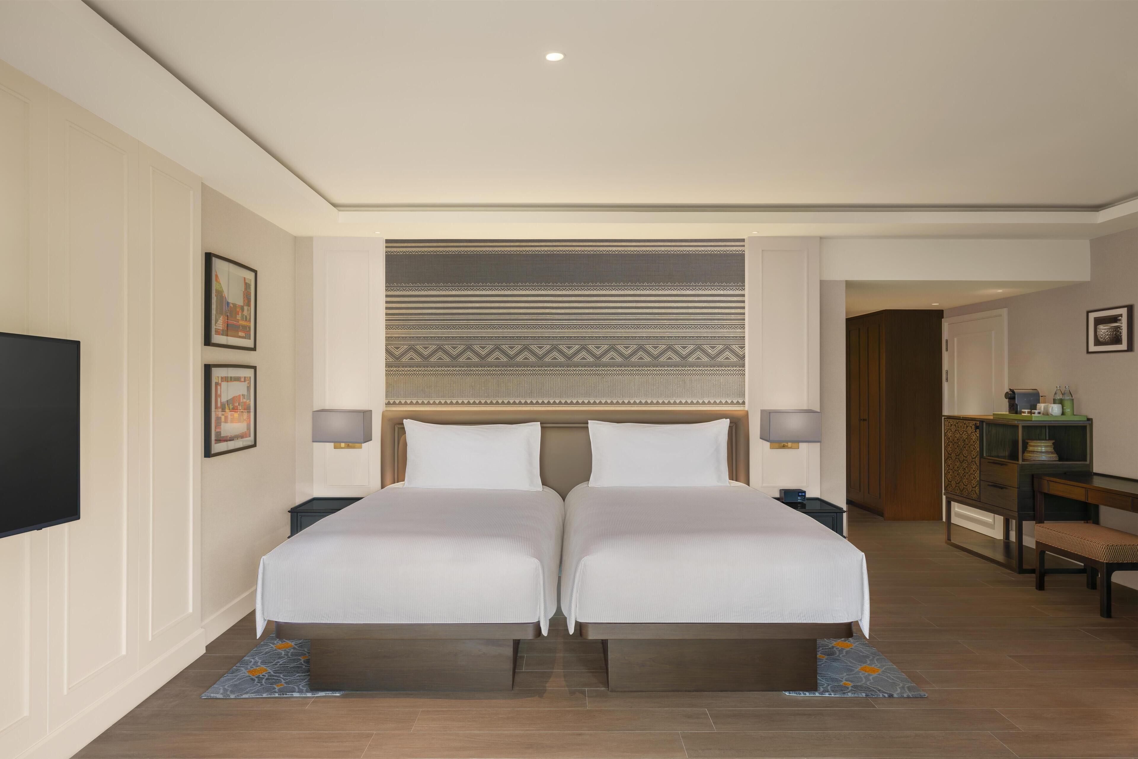 Down comforters, pillowtop beds, minibar, in-room safe
