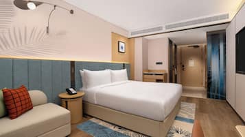 Premium bedding, down comforters, free minibar items, in-room safe