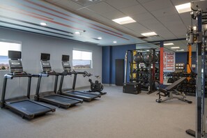 A gym with treadmills, an elliptical, and weightlifting equipment. - Hampton Inn & Suites By Hilton Buckeye Phoenix (Buckeye)