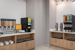 A beverage station with multiple dispensers, including options for milk, juice, and water. - Hampton Inn by Hilton Richmond Chester (Chester)