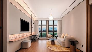 Deluxe Suite, 1 King Bed, River View | Living room